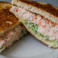 Crab · 100%  Crab blended with mayo, topped with lettuce on grilled sourdough bread.