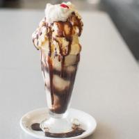 Sundae Rachel'S - · Served with Vanilla ice cream and a choice of one topping: Marshmallow, Strawberries, Pineap...