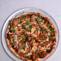 Bbq Chicken Pizza · BBQ sauce, BBQ chicken, smoked mozzarella, cilantro, and red onions.