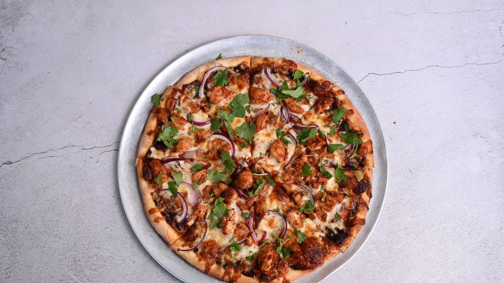 Bbq Chicken Pizza · BBQ sauce, BBQ chicken, smoked mozzarella, cilantro, and red onions.