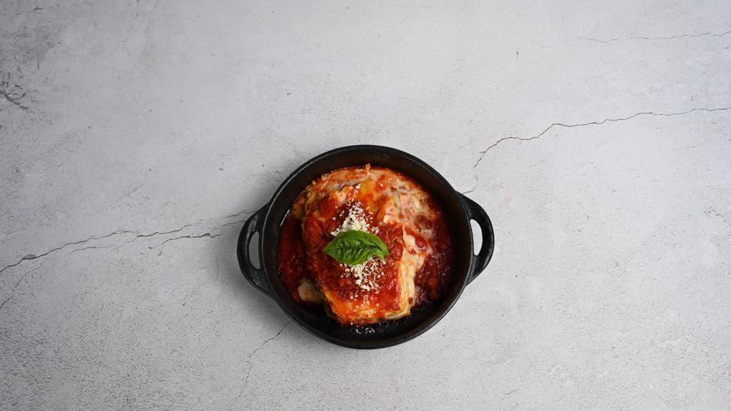 Meat Lasagna · homemade meat sauce layered with pasta, seasoned ricotta and mozzarella baked until bubbly