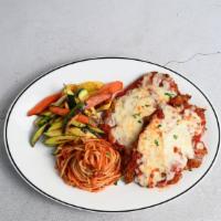 Chicken Parmigiana · crispy chicken breast, topped with marinara, parmesan and mozzarella, served with spaghetti ...