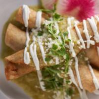 Sonora Style Taquitos · Crispy corn rolled tacos filled with braised shredded beef or machaca chicken, pasilla verde...