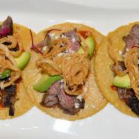 Rib Eye Steak Tacos · Chimichurri marinated rib-eye steak. Melted Mexican queso, caramelized poblano, and onion, a...