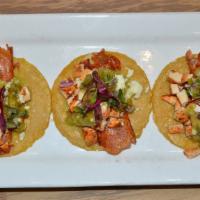 Pollo Asado Tacos · Chipotle marinated chicken breast, griddled Mexican queso, avocado tomatillo salsa, pickled ...