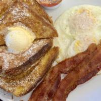 French Toast Combo · Four triangles, two eggs any style, and two bacon strips.