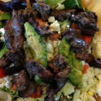 Fajita Steak Salad · Mixed greens, tomatoes, sweet corn, grilled peppers, grilled onion, steak, avocado, salsa, c...