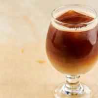 Organic Nitro Cold Brew Coffee · Served over coffee ice cubes