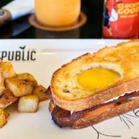 Breakfast Sammie · Jurassic pork bacon, tomato, herb spread, eggs sunny side up, and sourdough bread. Served wi...