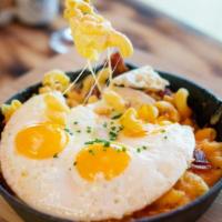 Breakfast Bacon Mac N Cheese · Topped with parmesan breadcrumbs, chives, and three eggs any style.