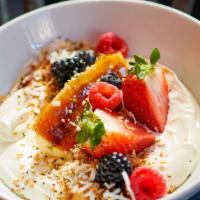 Yogurt Bowl · Contains nuts. Greek yogurt, house granola, bruleed banana, berries, chia, and coconut flakes.