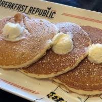 Buttermilk Pancakes · Topped with whipped butter and powder sugar