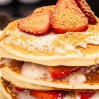 Strawberry Cheesecake Pancakes · Served with cheesecake cream, topped with powdered sugar.