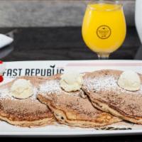 Churro Pancakes · Vegetarian. Dusted with cinnamon sugar, topped with whipped butter and powdered sugar.