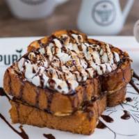 S'Mores · Vegetarian. Graham cracker crusted brioche bread topped with toasted marshmallows and chocol...