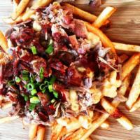 Red Neck Fries · Fries topped with pulled pork and mac n’ cheese.