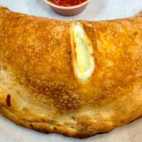 Cheese Calzone · Homemade and baked to order.  Filled with ricotta, Parmesan cheeses and served with a side o...