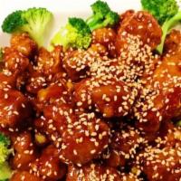 Sesame Chicken · Spicy. Chicken lightly breaded, fried until crispy, cooked in sweet spicy sauce with sesame.