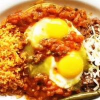 Huevos Rancheros · two sunny side up eggs, tomatoes, onions, cilantro, rice, beans, & homemade tortillas.