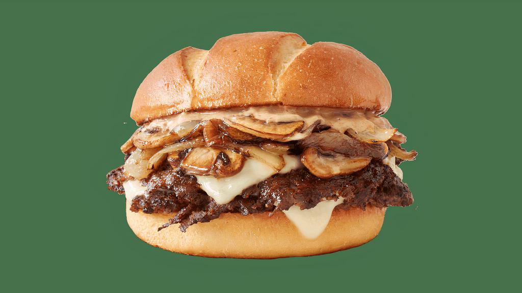 A1® Chophouse Double · Two sizzling steakburger patties, topped with grilled onions, sauteed mushrooms, white cheddar cheese and smothered with a zesty garlic and A.1.® sauce on a homestyle bun.