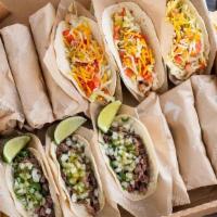 Taco Box · Delight in the convenience of feeding a small crowd with one menu item.  Taco Box comes with...