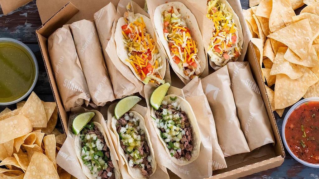 Taco Box · Delight in the convenience of feeding a small crowd with one menu item.  Taco Box comes with 6 CA tacos, 6 original tacos, 8 oz of Salsa Verde, 8 oz of Sharky's Salsa, and chips. Feeds 4 - 6 people.