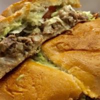 Tortas · your choice of meat, refried beans, lettuce, avocado, tomato, bolillo.