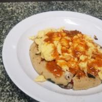 Breakfast Pupusa Beans And Cheese & Topped With Scramble Eggs. · Breakfast pupusa with beans and cheese & topped with scramble eggs.