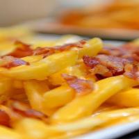 Bacon Bits Cheese Fries · Fries topped with cheese sauce and bacon bits.