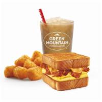 Breakfast Toaster® Combo · Fluffy eggs, melted cheese, and your choice of protein stacked on thick Texas toast.