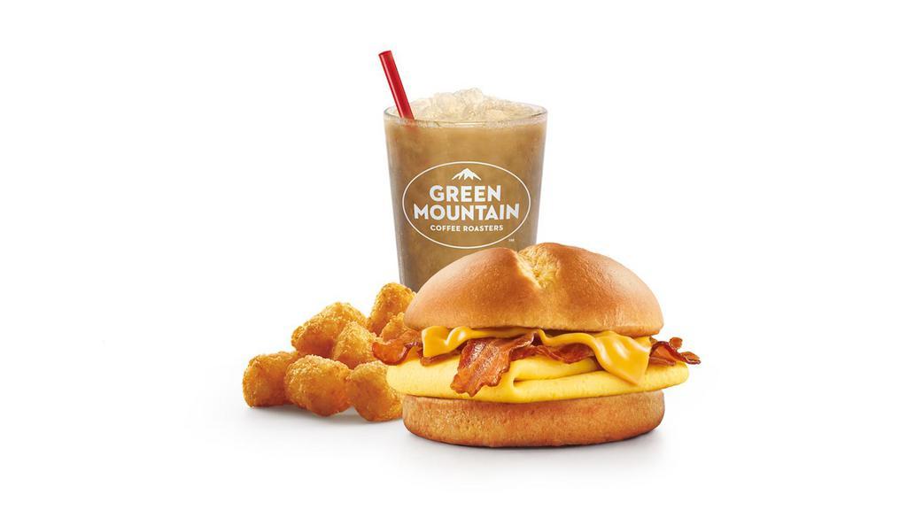 Brioche Breakfast Sandwich Combo · Served with cheese, egg, and your choice of bacon or sausage, on brioche bread. Includes choice of tots or fries and fountain drink.