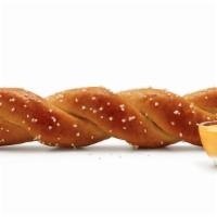 Soft Pretzel Twist & Cheese Sauce · Freshly made with butter and sea salt, comes with Cheese dipping sauce