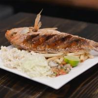 Red Snapper · Whole deep-fried red snapper fish served with a side of fries, macaroni crab salad, cabbage,...