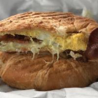 Sunrise Croissant · Your choice of meat, along with American cheese, egg and our house aioli, served on a grille...