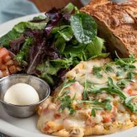 The Mexican Omelet · Three organic eggs, Roma tomatoes, green chilies, red onions, jack cheese & cilantro. Served...