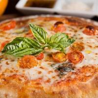 Margarita Pizza · Tomatoes, mozzarella cheese, and fresh basil.