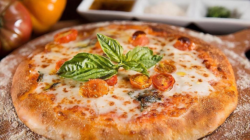 Margarita Pizza · Tomatoes, mozzarella cheese, and fresh basil.