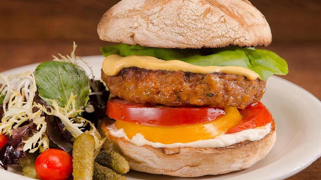 Turkey Burger · Fresh ground turkey (10 ounces) seasoned with herbs, sea salt,
Worcestershire and tomato. Grilled well and served on a rustic roll with Dijon mustard, mayonnaise, lettuce and tomato.
Served upon request only–locally grown mixed greens salad.