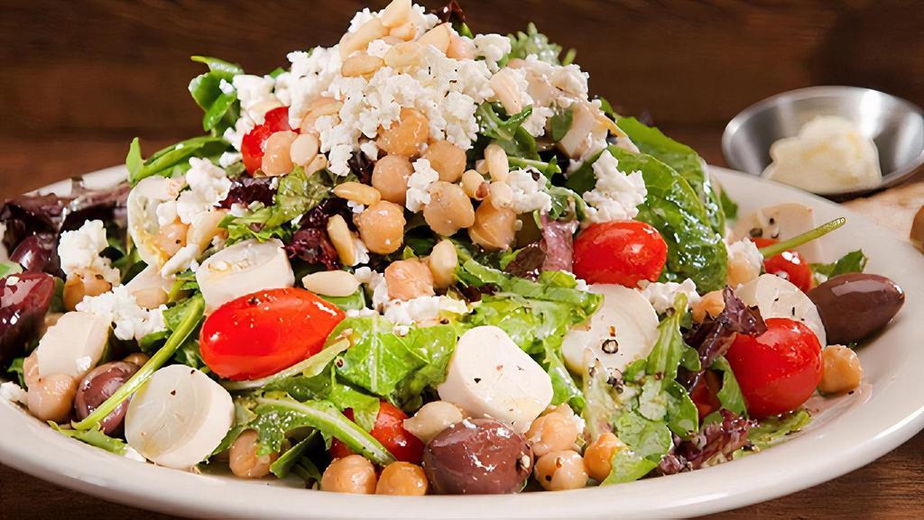The Urth Salad - Full · Our famous salad made with locally grown mixed greens, feta cheese, Roma tomatoes, hearts of palm, garbanzo beans, Kalamata olives (with pits), & pine nuts in Urth vinaigrette dressing, with fresh bread.