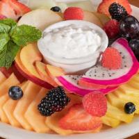 Fresh Fruit Plate With Yogurt Or Cottage Cheese - Full · An array of the finest seasonal fruits served with yogurt or cottage cheese. Please allow an...