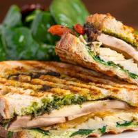 Vegan Panini Portabella · Grilled portabella mushrooms, roasted peppers, wild arugula,
grilled artichokes with pesto a...