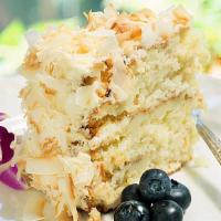 Coconut Royale Cake Slice · Moist coconut sponge cake filled with delicious coconut pastry cream.