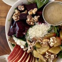 Roasted Beets · Romaine hearts, mixed greens, red and yellow beets, sliced apple, goat cheese, and toasted w...