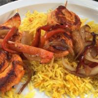 Grilled Kebabs · Choice of two juicy marinated skewers topped with grilled onions and bell peppers with a lem...