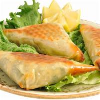 Spanakopita (3 Pieces) · Handcrafted spinach pie, onions with feta cheese.