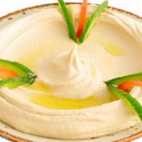 Hummus · Vegan. Chickpeas dip with tahini, garlic, lemon juice, and olive oil.