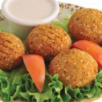Falafel (4 Pieces) · Vegan. Vegetarian handcrafted chickpea patties with, onions, garlic, herbs, and spices, serv...