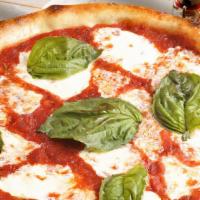 Pizza Margherita · House-made tomato sauce, fresh Mozzarella cheese, fresh basil, and virgin olive oil.