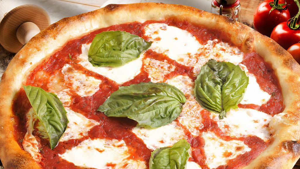 Pizza Margherita · House-made tomato sauce, fresh Mozzarella cheese, fresh basil, and virgin olive oil.