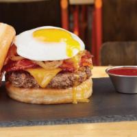 Glaze Of Glory Donut Burger · All-natural angus beef, cheddar cheese, sweet and spicy bacon, caramelized onions, and a fri...